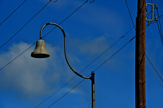 Street lamps in the shape of the historic El Camino Real bells line Mission Boulevard in Mission San Jose, California 