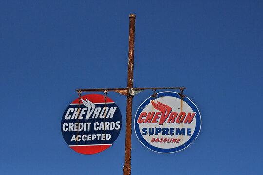 Circular Late 1940&rsquo;s Early 1950&rsquo;s gasoline signs on tall metal pole from bygone era, Sierra Nevada Foothills, California 