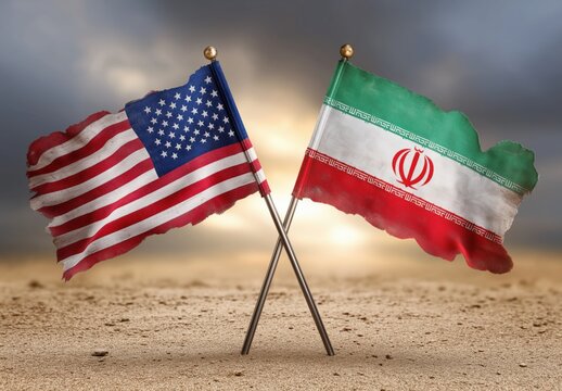 Tattered US & Iran flags crossed on arid ground reflect intense international political tension