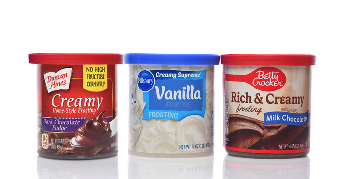 IRVINE, CALIFORNIA - 16 APR 2026: Three cans of frosting from the major national brands, Betty Crocker, Pillsbury and Duncan Hines.