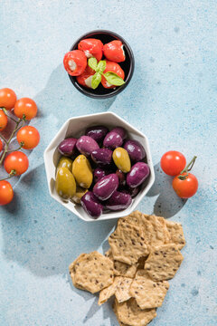 Mediterranean appetizer antipasti tapas bowls with green and calamata olives feta cheese stuffed pepper herbs