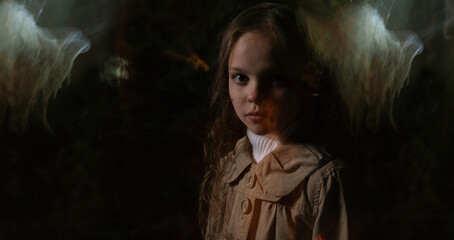 A little girl runs through the night forest escaping from ghosts.