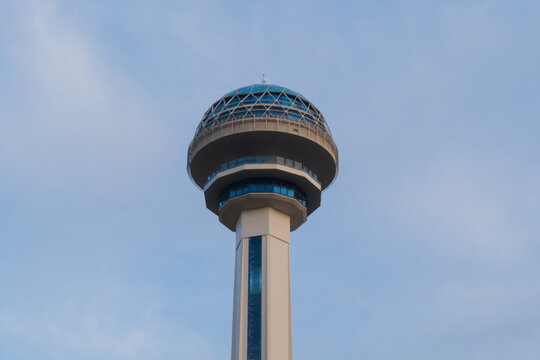 Atakule TV communication, observation tower against the cloudy sky with clouds in Ankara, Turkey - evening. Cityscape and architecture concept