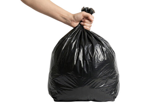 Hand holding a full black plastic garbage bag ready for disposal. Isolated on transparent background, png
