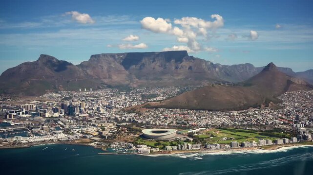 Aerial Cape Town Skyline With Table Mountain. Green Point Stadium And Atlantic Coast Stretch Below, Sunlit