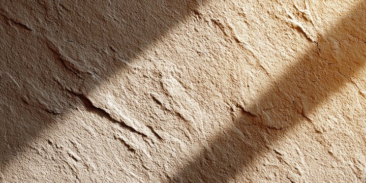 Textured wall with natural light and shadow creating unique patterns