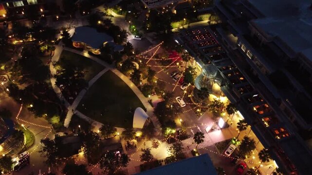 Aerial overhead night view of illuminated urban neighborhood streets and trees in San Pedro Garza Garcia Nuevo Leon Mexico