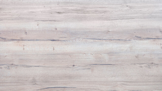Smooth natural wooden surface with vertical grain patterns. Warm beige tones and natural texture. Ideal for backgrounds, design projects, or rustic