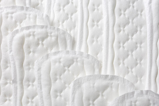 Сlose-up of feminine hygiene pads. The concept of simple care and  beauty minimalism. Selective focus and space for text