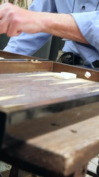 Playing Backgammon in Vertical Format &ndash; Dice Rolling and Hands Close-Up 4K