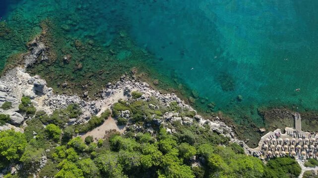 Aerial view of Anthony Quinn Bay with turquoise water and rocks in Rhodes