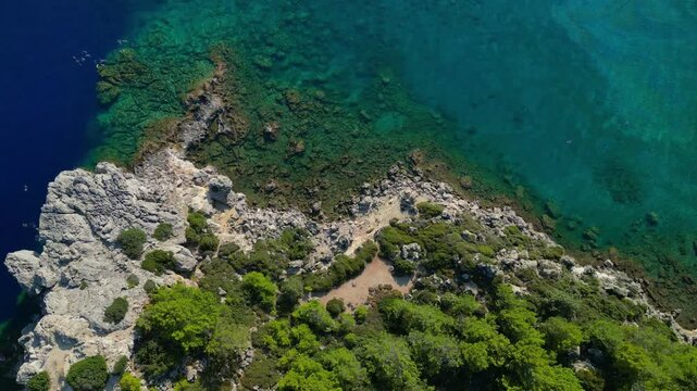 Aerial view of Anthony Quinn Bay with turquoise water and rocks in Rhodes