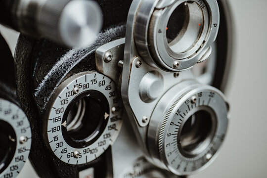 Phoropter cylinder axis scale for vision correction measurement. Close-up of the cylinder axis scale and rotating dials on a refractor used for determining lens prescriptions.