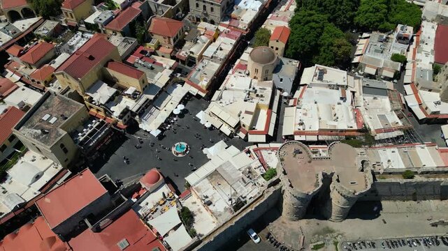 Aerial view of the medieval Marine Gate towers and Hippocrates Square in Rhodes Old Town