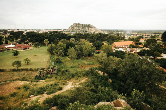 Aerial View of an African Town Nestled Among Trees and Rock Formations