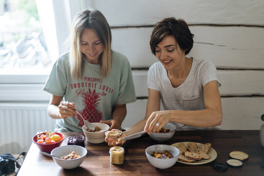 Two women having breakfast at home