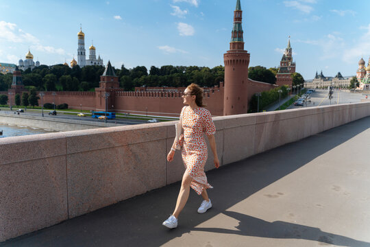 Young modern woman near Moscow Kremlin