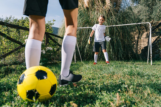 Two soccer players train on the sports field