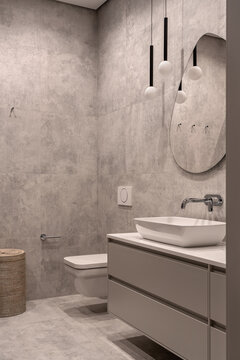 Bathroom in contemporary style with tiled walls