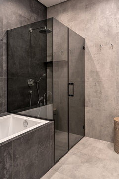 Bathroom in contemporary style with tiled walls