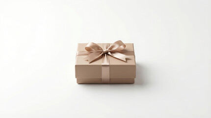 Obraz premium Elegant tan gift box with silk ribbon and bow on white background.