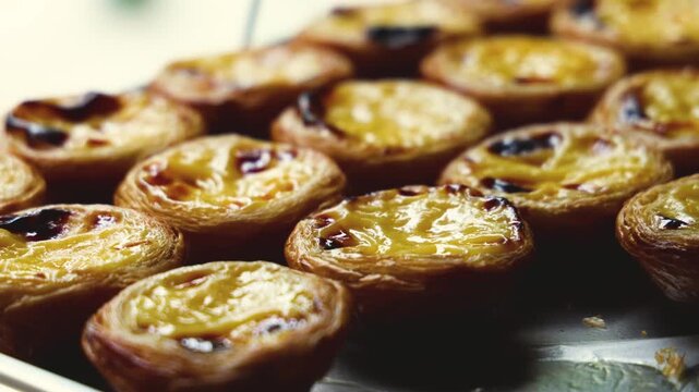 Pasteis and Pastel de nata, traditional Portuguese egg custard tart pasty cakes, dessert Pasteis de nata with different pastry in the cafe, bakery display window, Pastel de belem, Lisbon, Portugal