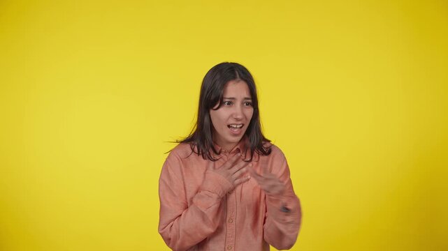 Surprised young woman laughing and celebrating her victory