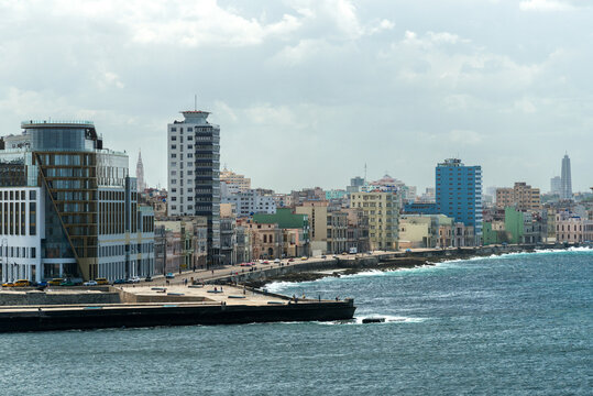 Cuba, Havana.  The Malec&oacute;n, wide road and pedestrian promenade on the seafront of the city.  Viewed from the Castillo del Morro
