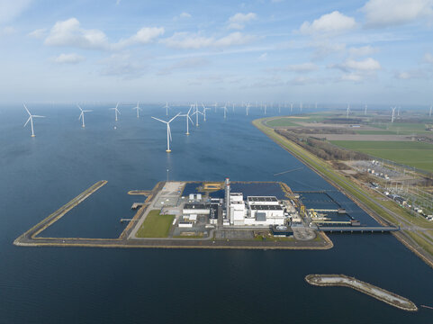 Aerial view of the ENGIE Maxima plant power station and offshore wind farm turbines on the IJsselmeer coast in Lelystad, Flevoland, Netherlands.