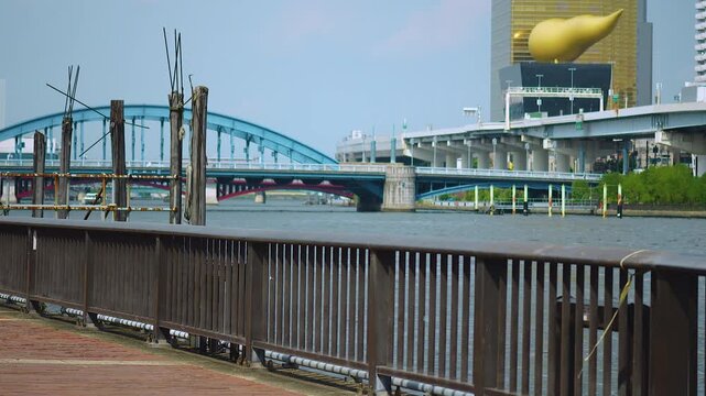 Footage of Komagata Bridge seen from the riverside along the Sumida River. Tokyo urban scene