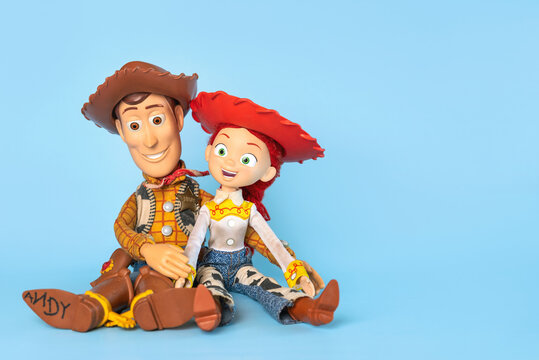 Woody and Jessie action figures characters from the Toy Story movie Disney Pixar saga and space for text. Illustrative editorial