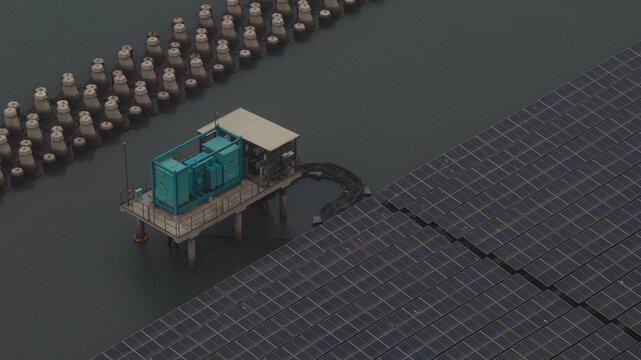 Aerial view of floating solar panels and a power transformer station on the water at the Changhua Coastal Industrial Park, Haipu Village, Changhua County, Taiwan.