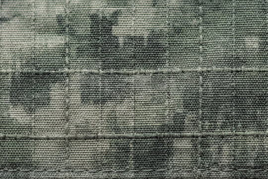 Green Digital Camo Background with Ripstop Fabric Texture and Grid Pattern