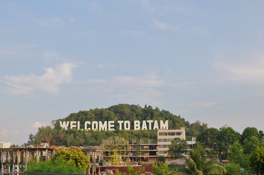 Batam - Indonesia, April 17th 2026 : Welcome to Batam landmark sign located on a hill overlooking the city in Batam, Indonesia.