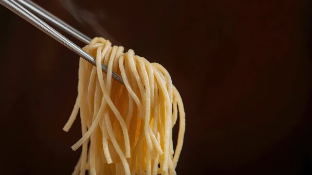 Steaming noodle and pasta dinner wheat spaghetti with chopstick lifted, warm savory comfort