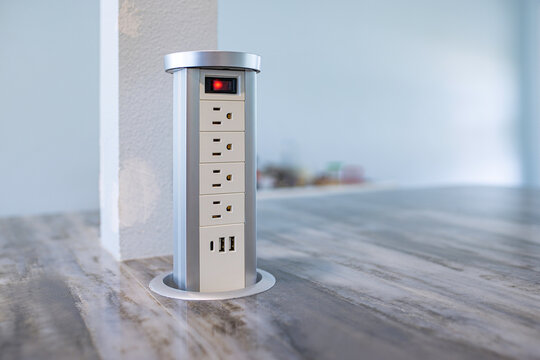 Pop up countertop power outlet with USB ports and switch in modern kitchen