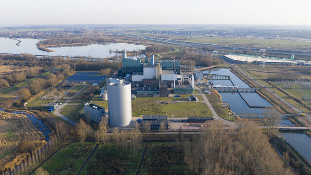 Aerial view of the Vattenfall Elektriciteitscentrale Diemen power plant with industrial structures and cooling water channels in Diemen, Noord-Holland, Netherlands.
