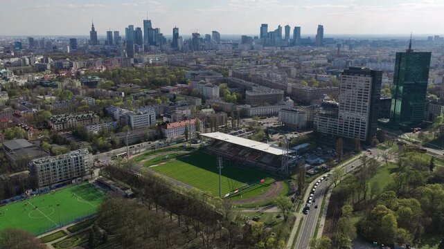 Polonia Warszawa Stadium Stands Amid the Urban Landscape of Warsaw, Poland - Orbit Drone Shot