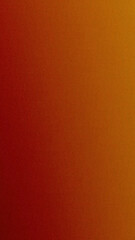 Fototapeta premium Elegant vertical blend from deep red to golden tones with fine grain, creating a warm sophisticated backdrop perfect for branding, invitations, social media graphics, or web headers.