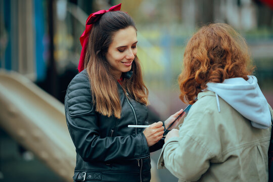 Woman Filling Out a Digital Questionnaire on Tablet
Professional sociologist conducting a street survey with a female passerby