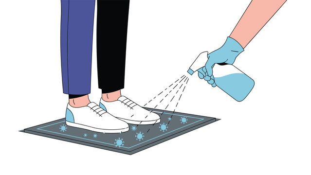 Person standing on a sanitizing mat while a hand in a glove sprays disinfectant on shoes to prevent virus spread.