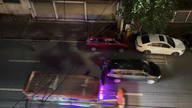 Overhead View of Jeepneys and Traffic on Manila Street at Night