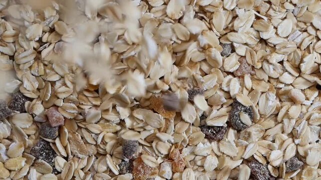 Oatmeal Flakes and Dried Fruit Falling in Slow Motion