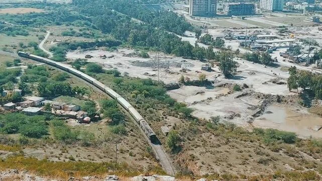 Breathtaking High Angle View of Train Journeying Through Islamabad Pakistan