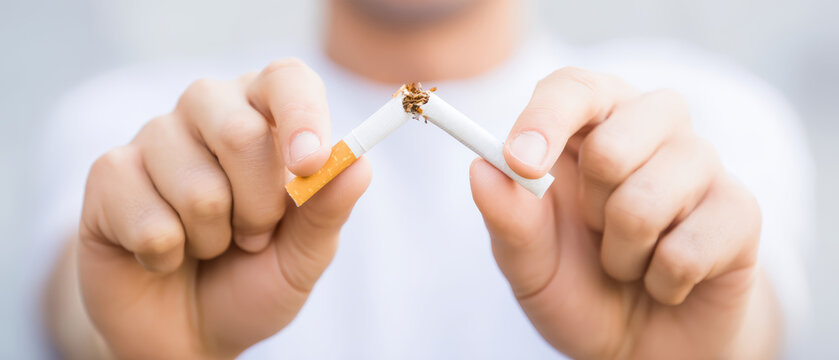 Quit smoking broken cigarette stop tobacco hand male health addiction nicotine no smoking protest quit smoking broken cigarette stop tobacco hand
