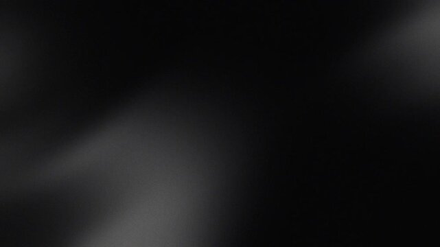 Black grainy gradient background with soft light leaks and cinematic noise texture for minimalist dark aesthetic design