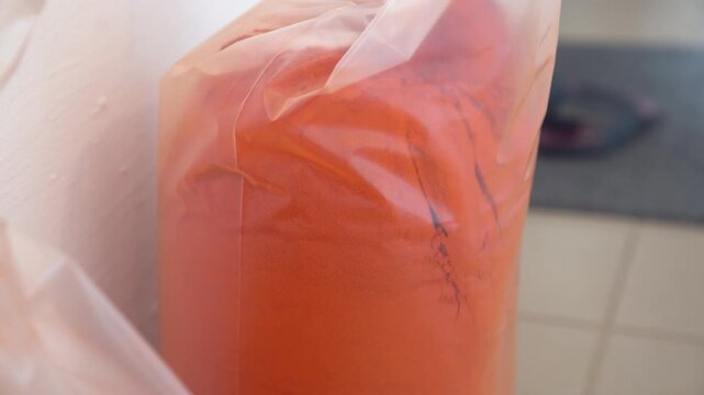 Ground pepper powder filling plastic bag, spice production in factory and ready for distribution