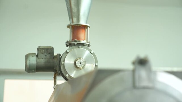 Industrial grinding machine processing pepper, producing spice for food seasoning