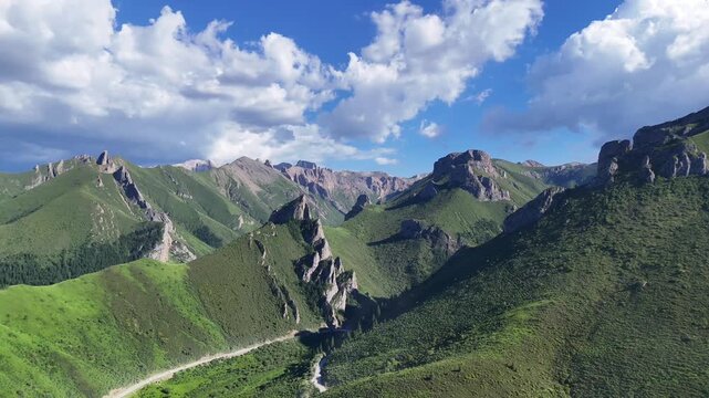 Slow Drone Orbit Over Mountain Ranges on Rock Road, Gansu