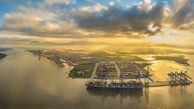 Aerial top down view of a large container cargo ship in motion over open ocean Ba Ria Vung Tau, Ho Chi Minh city, Vietnam
